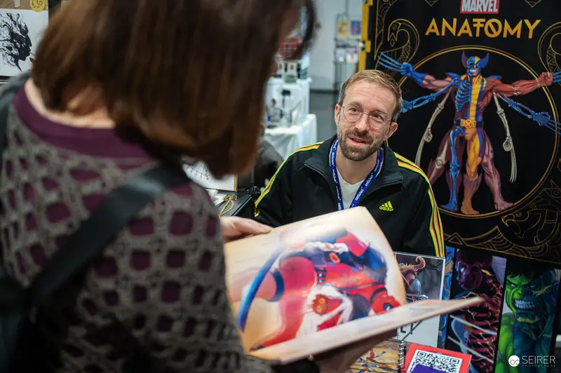 Marvel Comics Artist Demonstrates Anatomy Poster at Comic Convention