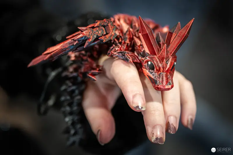 Intricate Red Dragon Ring Sculpture at Vienna ComicCon 2024