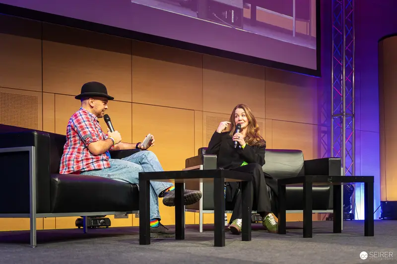 VIECC 2024: Comic Convention Panel Discussion with Two Speakers on Stage