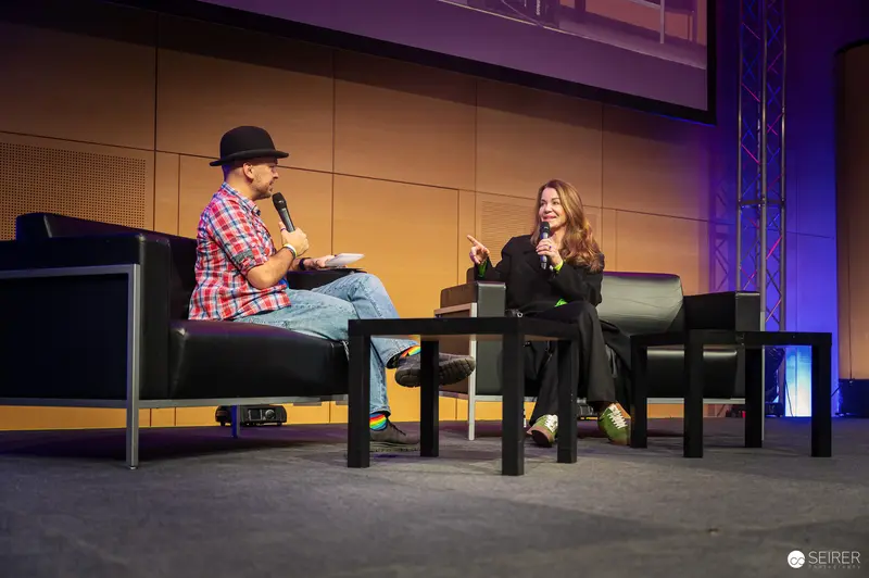 Panel Discussion at Vienna ComicCon 2024 with Seated Presenter and Interviewer