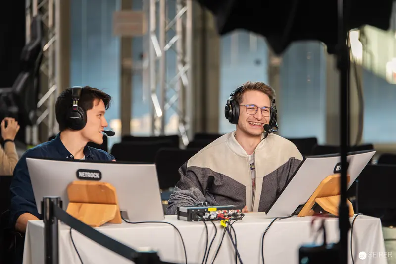 Esports Commentators at Tech Workstation During Gaming Tournament Livestream