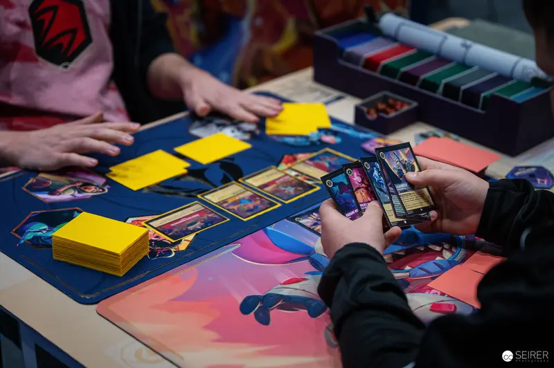 Card Game Players at Vienna ComicCon 2024 Trading Strategy Battle