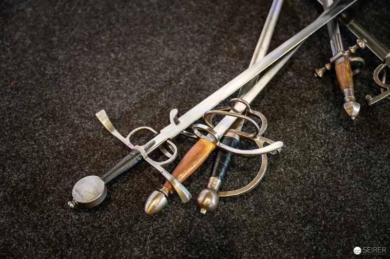 Vintage European Swords Displayed on Dark Background