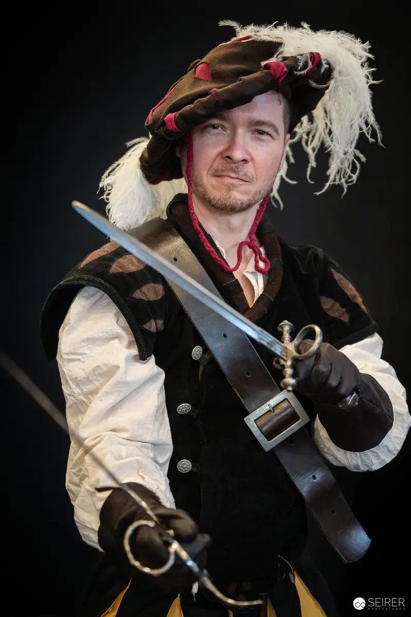 Costumed Performer with Sword at Vienna ComicCon 2024 Dramatic Portrait