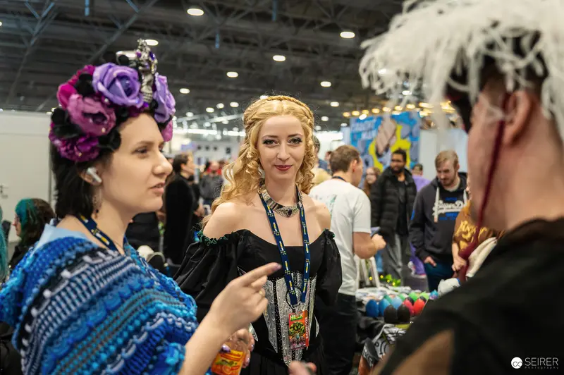 Vienna ComicCon 2024: Cosplayers in Vibrant Outfits Interact at Convention Floor