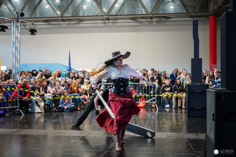 Cosplayer in Period Costume Performs at Vienna ComicCon 2024