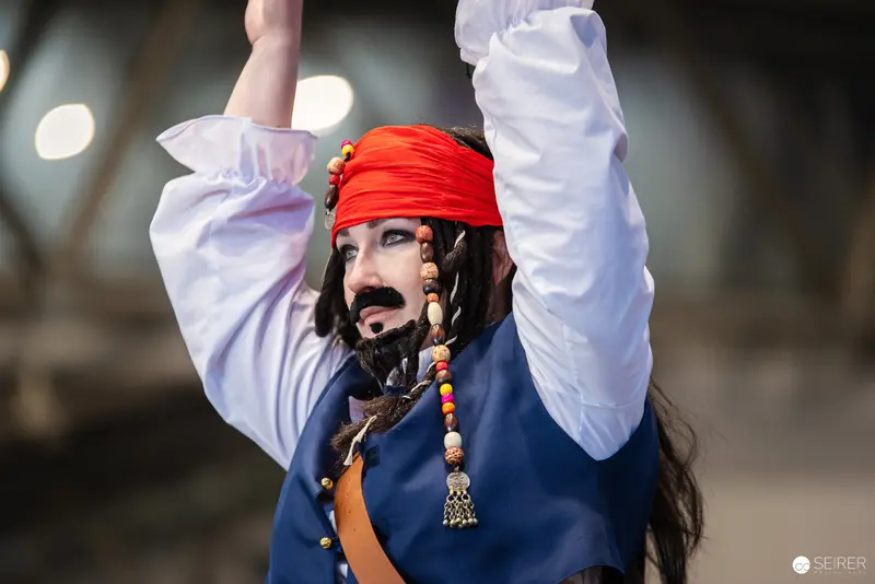 Costumed Pirate Performer at Vienna ComicCon 2024 Raising Arms Dramatically