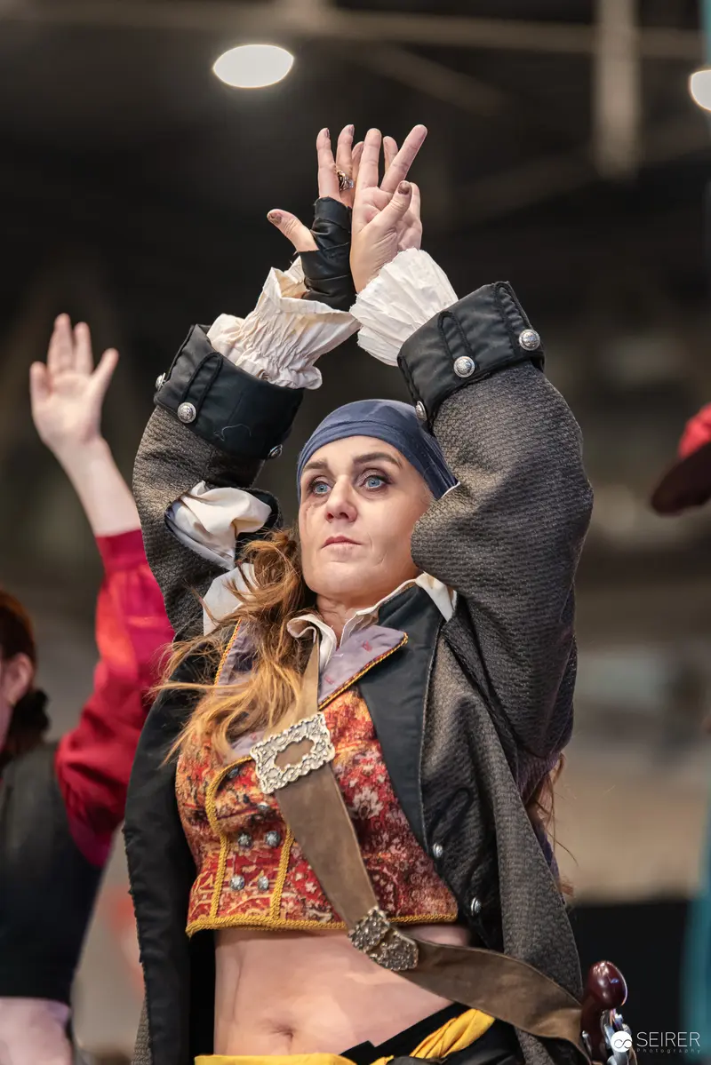Cosplay Performer in Dynamic Pose at Vienna ComicCon 2024