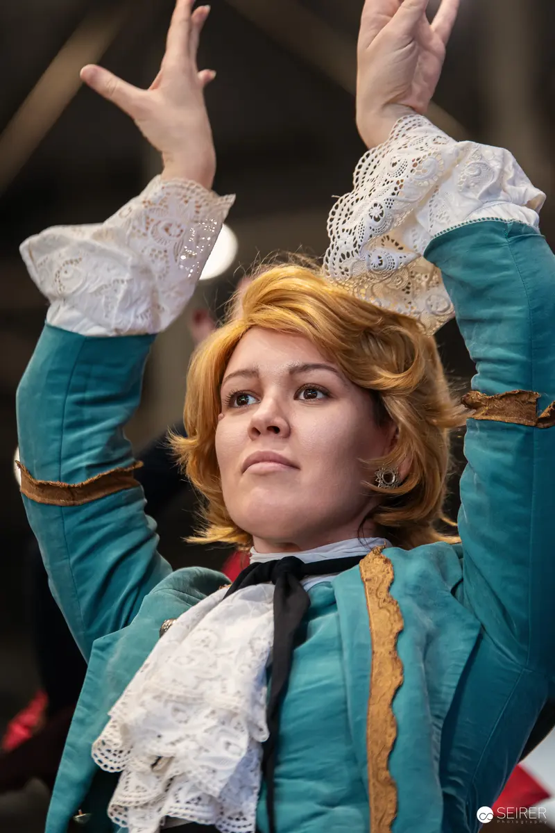 Cosplayer in Baroque-Style Turquoise Costume at Vienna ComicCon 2024