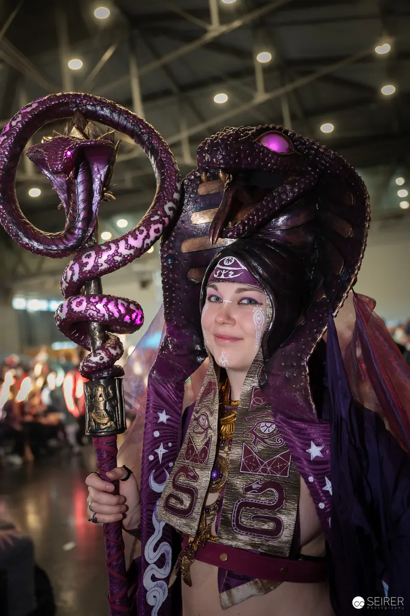 Cosplayer in Intricate Purple Snake-Themed Costume at Vienna ComicCon 2024