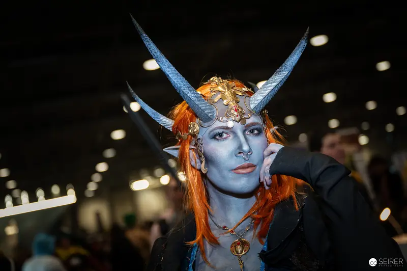 Blue-Skinned Horned Cosplayer at Vienna ComicCon 2024 Fantasy Showcase
