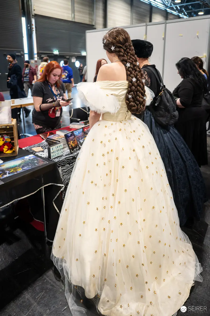 Cosplayer in Elegant White Ballgown at Vienna ComicCon 2024