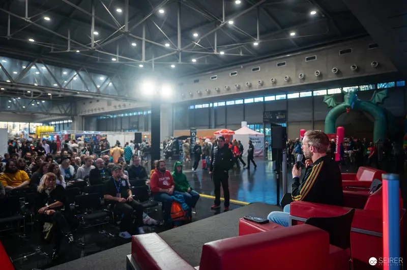 Audience at Vienna ComicCon 2024 During Panel Discussion in Convention Hall