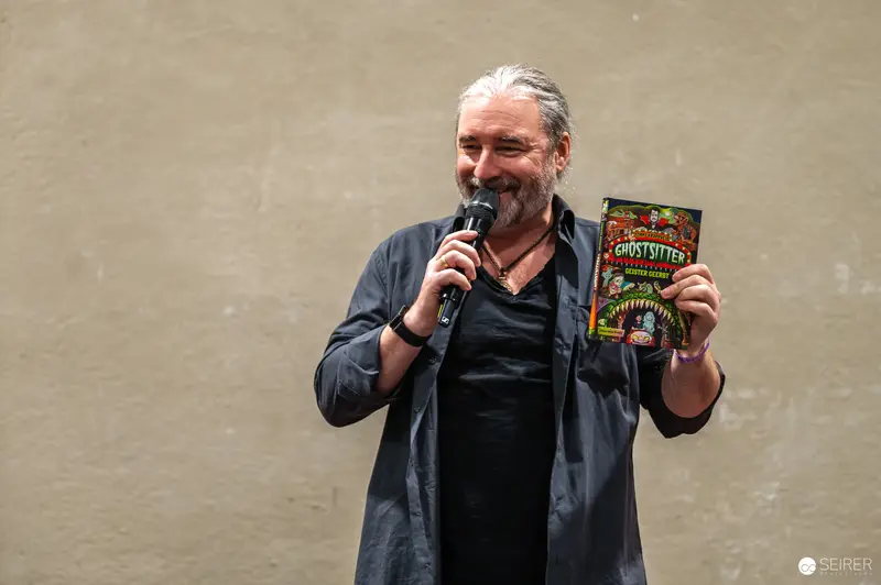 Comic Author Presents Book at Vienna ComicCon 2024 Author Signing