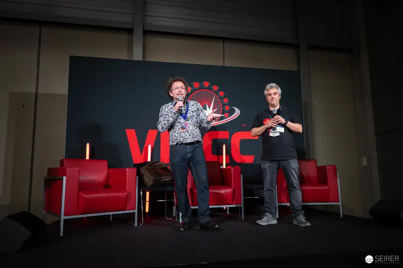 Comic Con Speakers Discuss Pop Culture on Red Chairs at VIECC 2024