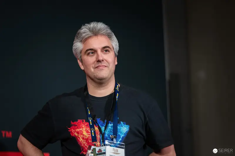 ComicCon Attendee in Black Shirt with Lanyard at VIECC 2024