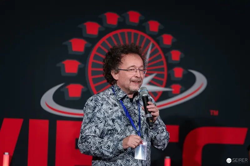 Speaker at Vienna ComicCon 2024 Presenting on Stage with Microphone