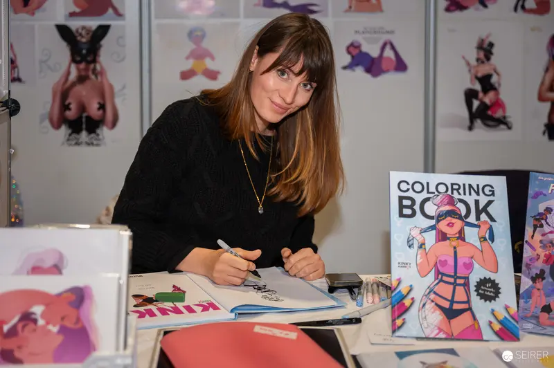 Artist Signing Colorful Body-Positive Illustration Book at Comic Convention