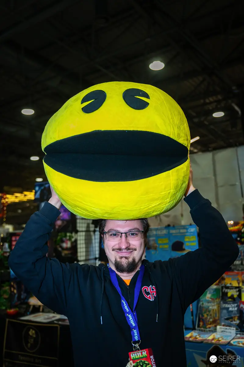 Comic Con Attendee Poses with Giant Pac-Man Costume Prop