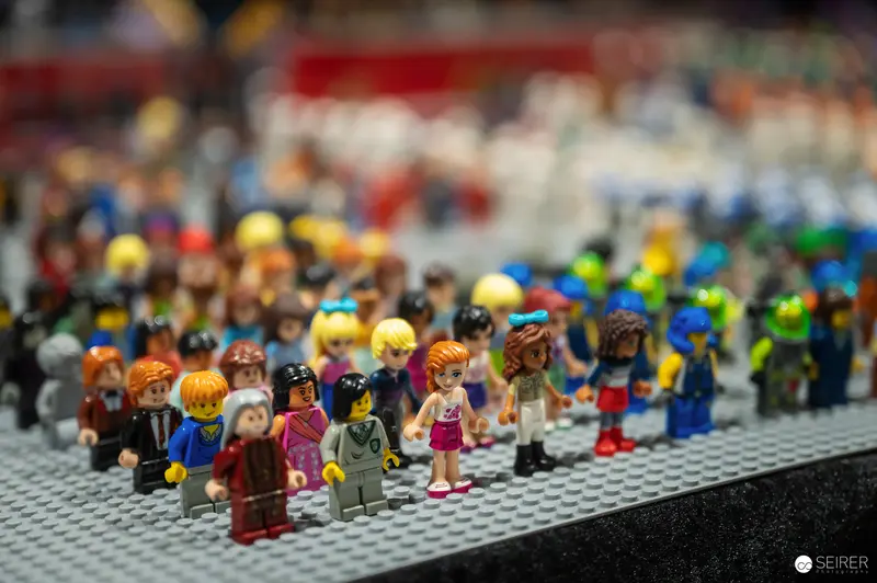 Diverse LEGO Minifigures Assembled on Gray Baseplate at Detailed Scale