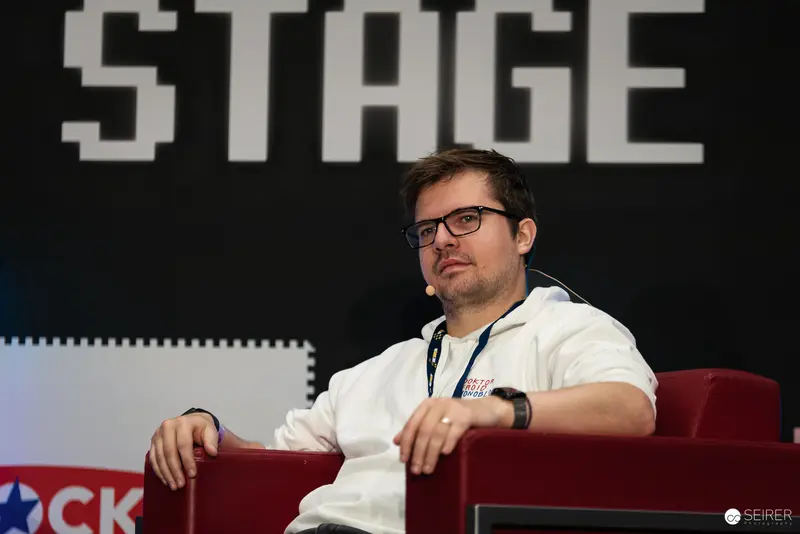 Speaker on Stage at Tech Conference Discussing Digital Trends