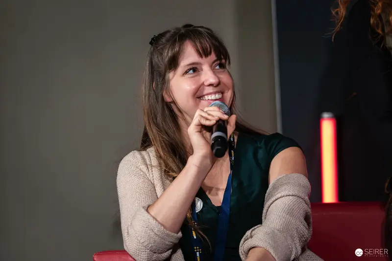 Speaker Engaging Audience at Vienna ComicCon 2024 Panel Discussion