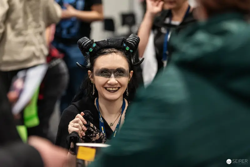 Horned Cosplayer Smiling at Vienna ComicCon 2024 Fantasy Convention
