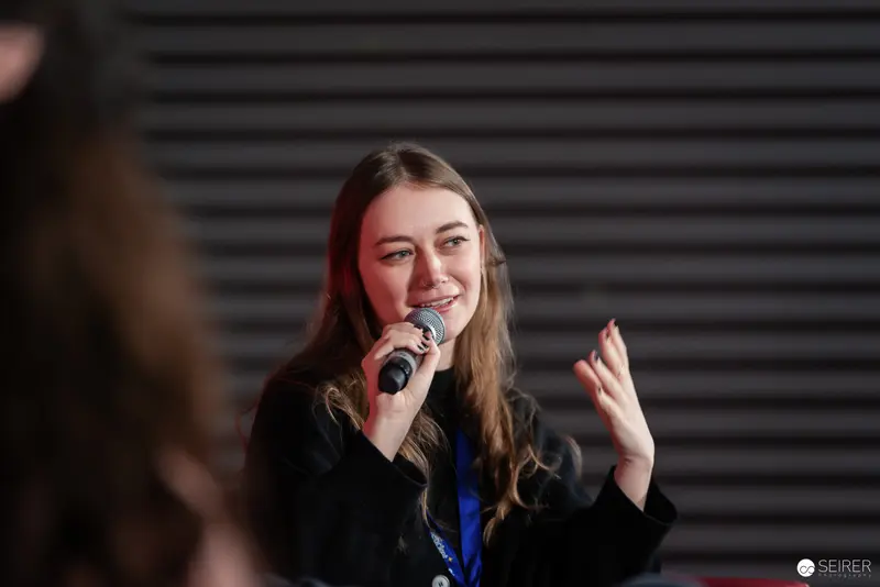 Speaker Engaging Audience with Microphone at Vienna ComicCon 2024