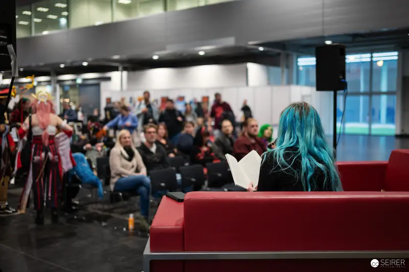 Blue-Haired Attendee at Vienna ComicCon 2024 Convention Venue