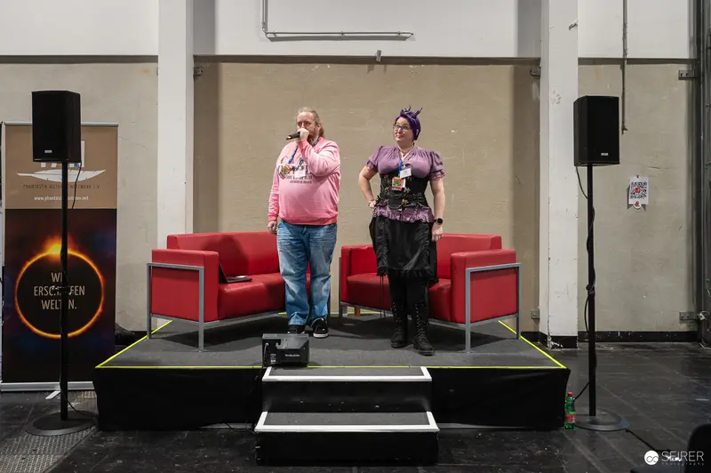 Two Speakers on Stage at Vienna Comic Con 2024 Conference