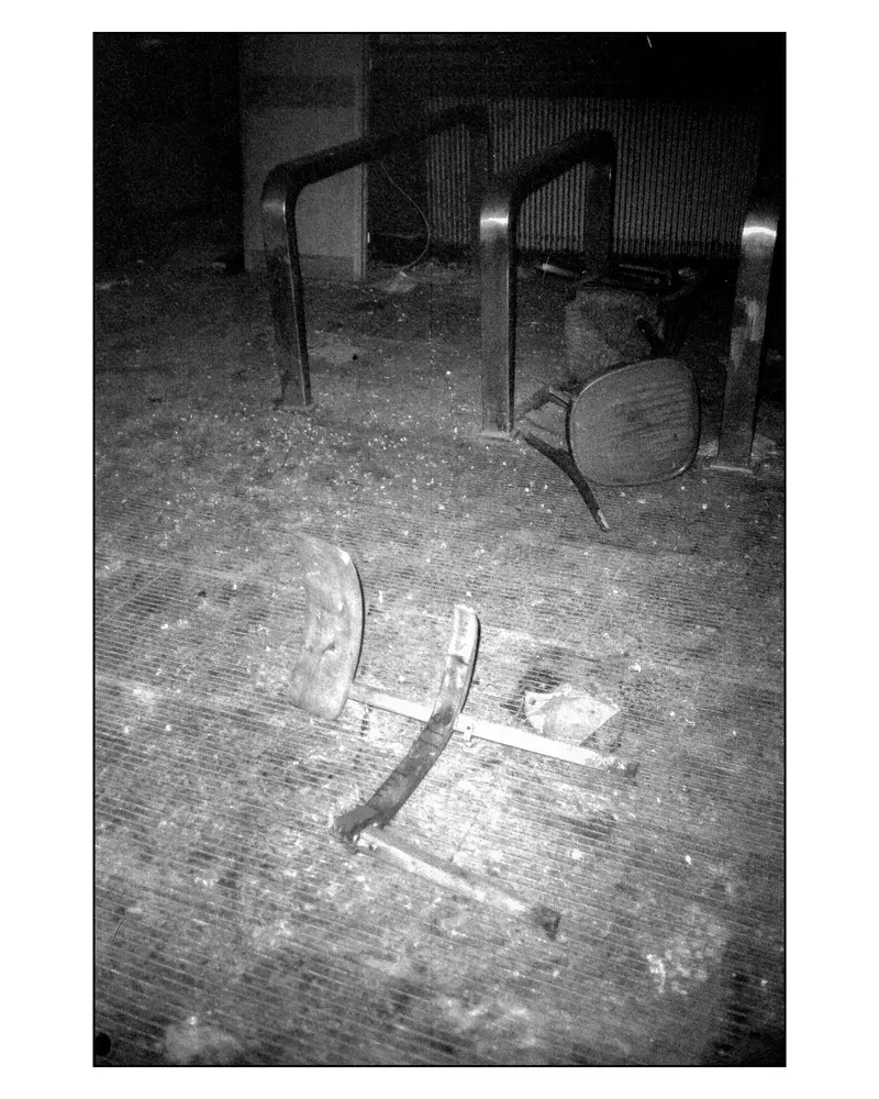 Wrecked Chairs and Debris on Abandoned Interior Floor, Villach–Grado Trip 2024