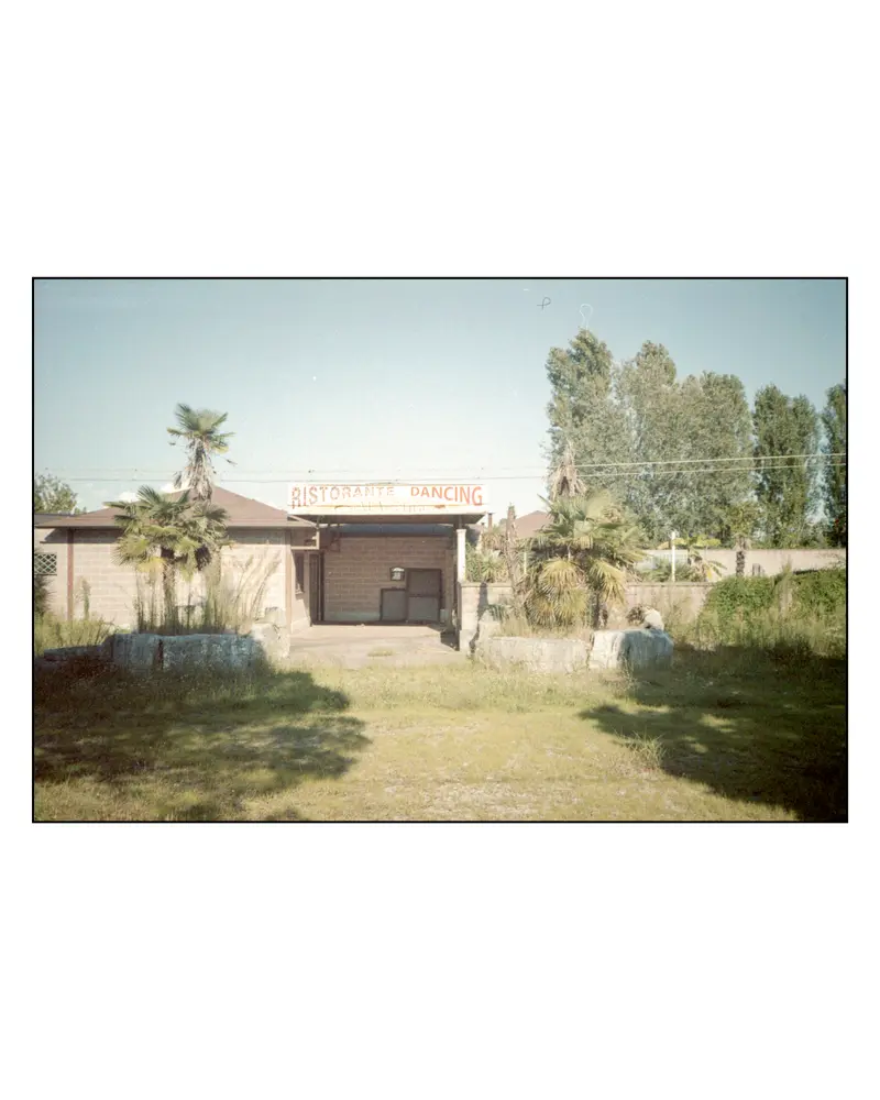 Abandoned "Ristorante Dancing" roadside venue with palms near Grado, Italy