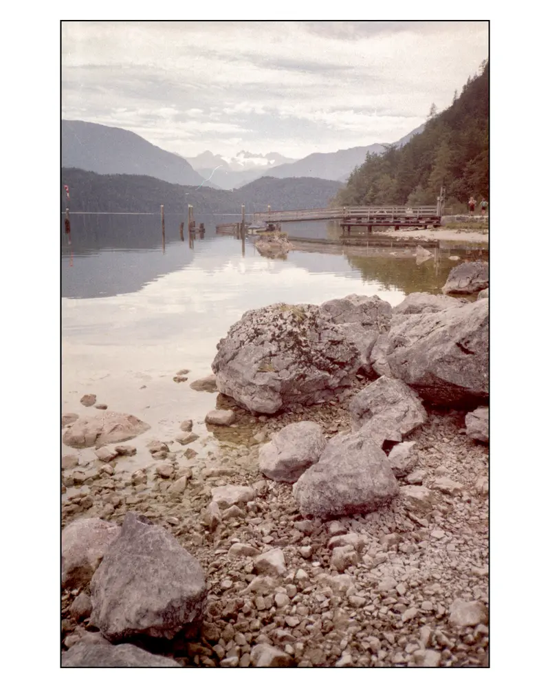 Rocky Alpine Lakeshore with Wooden Jetty and Mountain Ridges, Villach–Grado Route 2023
