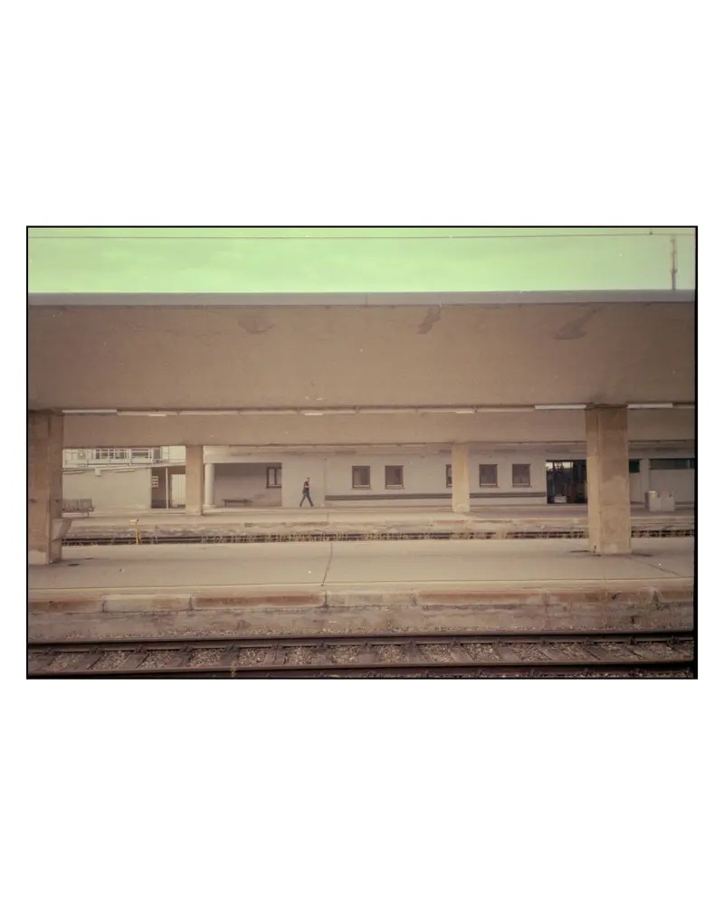 Lone Traveller Crossing Empty Railway Platform on Villach–Grado Journey, 2023