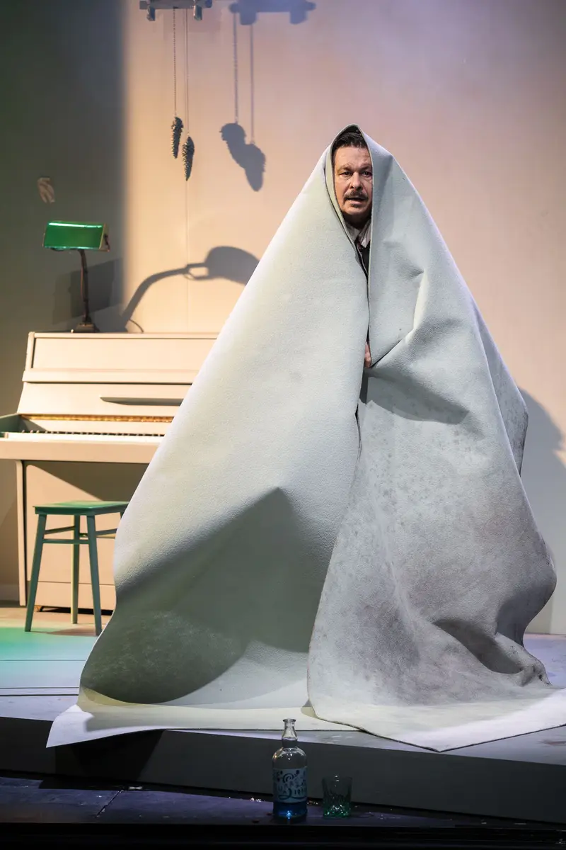 Michael Dangl Wrapped in Blanket During "Die Affäre Rue de Lourcine" Theater Rehearsal
