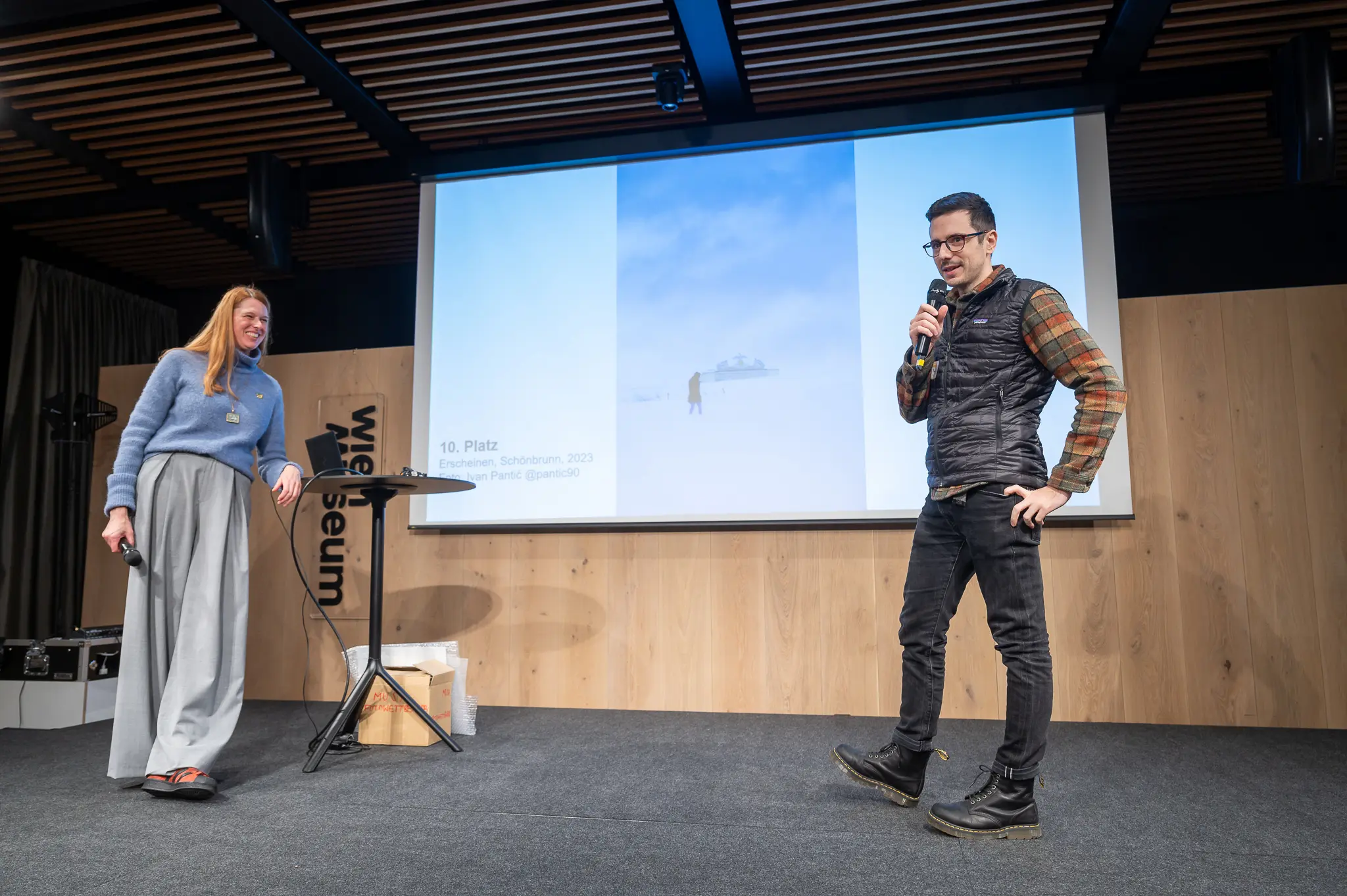 Design Conference Presentation with Two Speakers on Museum Stage