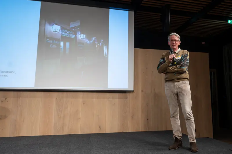 Design Conference Speaker Presenting Lecture on Urban Architecture and Street Imagery