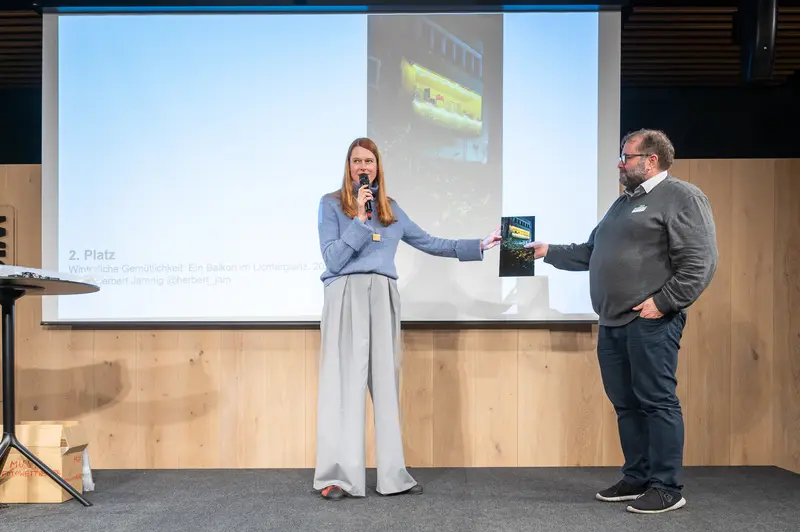 Award Presentation at Professional Conference with Book and Projector Backdrop
