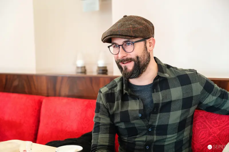 Falk Holzapfel at Cafe Museum in Vienna During Interview with Janett Cernohuby