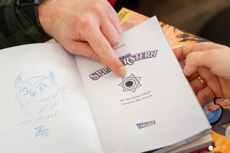 Signing Spipstern Comic Book at Publishing Event