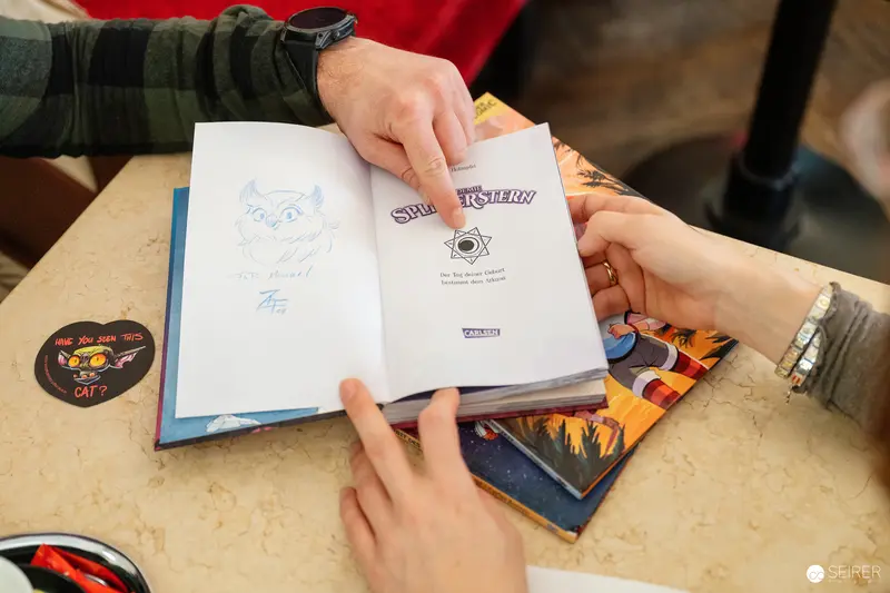 Book Signing or Reading with Hands Holding Open Book