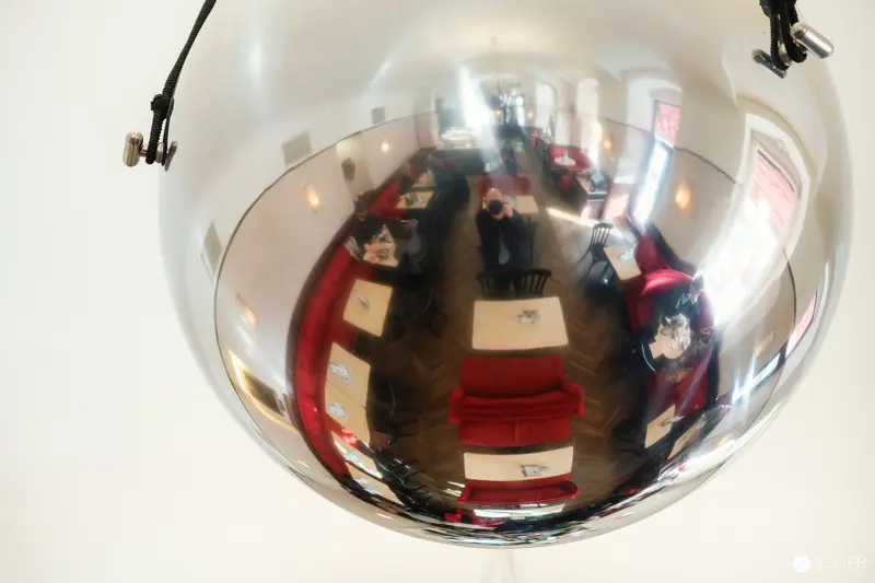 Distorted Reflections in Convex Ceiling Mirror at Interior Space