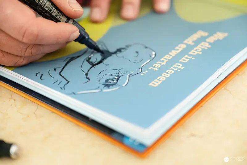 Pen Drawing Character Sketch on Blue Book Cover