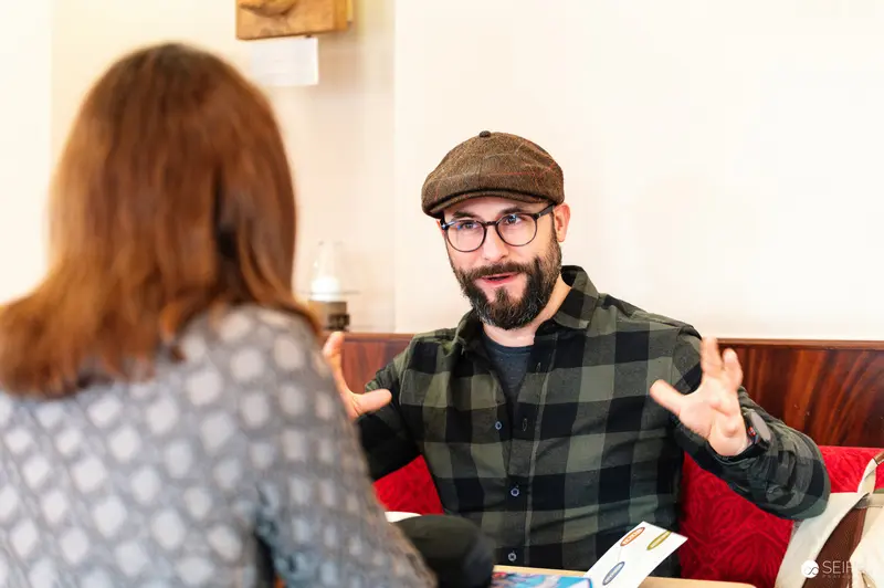 Falk Holzapfel Interviewing Janett Cernohuby at Cafe Museum in Vienna