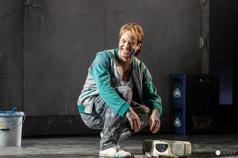 Actor in Teal Jacket Rehearsing for "Azur oder die Farbe von Wasser" at Theater in der Josefstadt