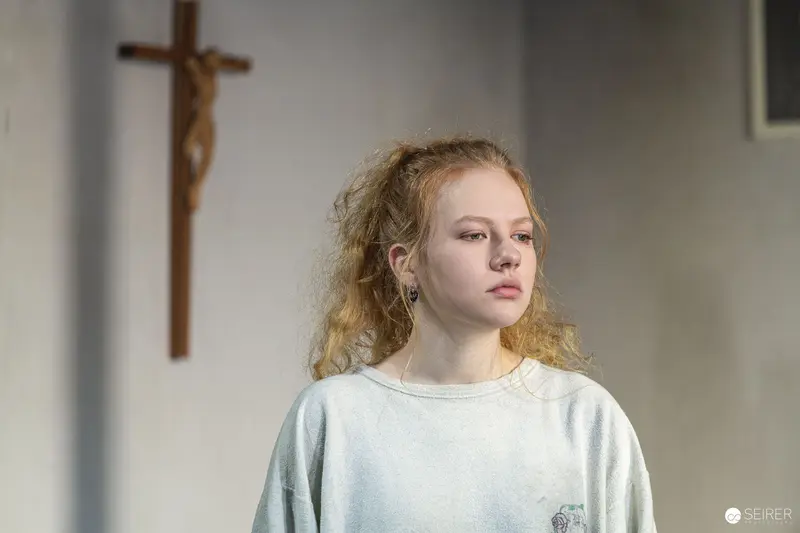 Young Performer in White Sweater During Theater Rehearsal for "Azur oder die Farbe von Wasser"