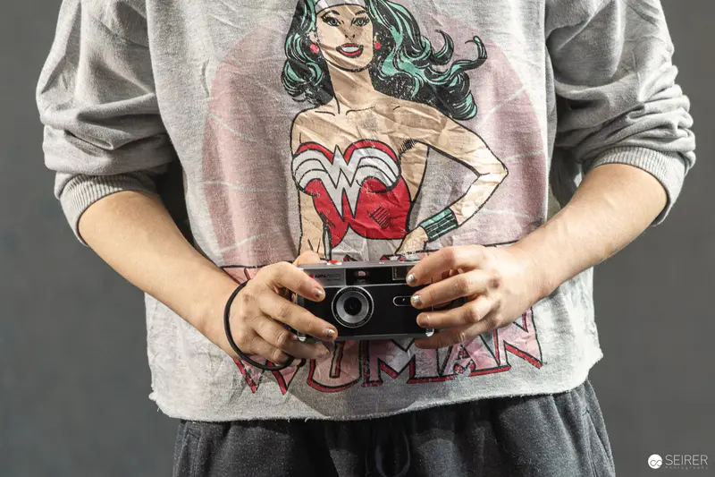 Wonder Woman Graphic Tee and Vintage Camera in Creative Still Life