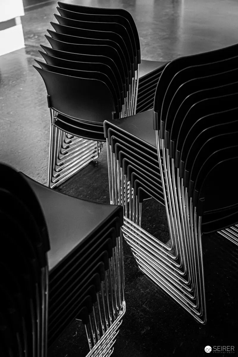 Stacked Modern Chairs Revealing Geometric Shadows and Patterns