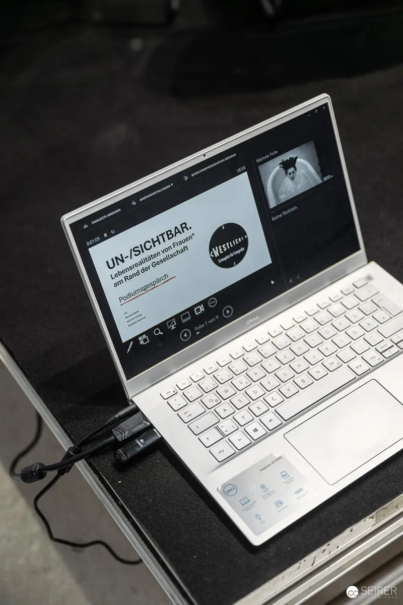 Laptop Displaying UN-/SICHTBAR Event Screen at WestLicht Photography Event