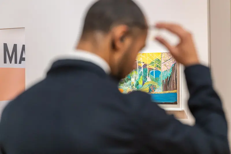 Art Curator Hanging Van Gogh Painting at Albertina Museum Exhibition